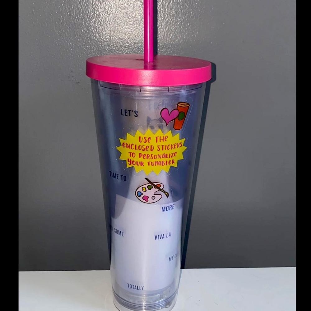 Brand new Starbucks drinking cup with stickers.